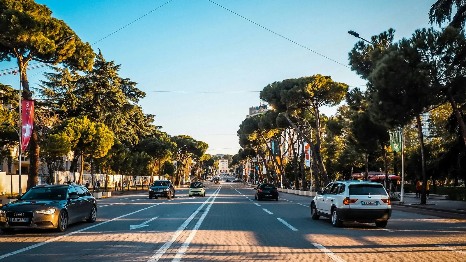 Cars on a clear Tirana road, illustrating safe driving in Albania
